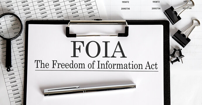 Paper with The Freedom of Information Act FOIA on a table
