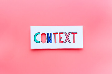 Context marketing concept. Word Context on paper banner, top view