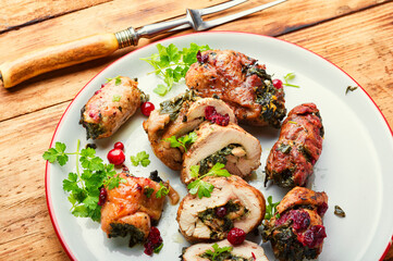 Stuffed meat rolls on a plate.