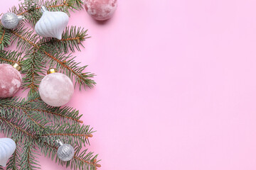 Fototapeta na wymiar Fir tree branch with beautiful Christmas balls on color background