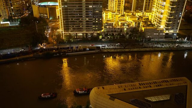 Traffic and River in City at Night 