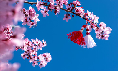 Banner Spring border or background with pink blossom and Bulgarian symbol of spring - martenitsa....