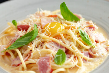 Pasta Carbonara with bacon and cream served on plate