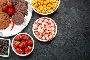 top view delicious choco biscuits with snacks on dark background photo sweet cookies