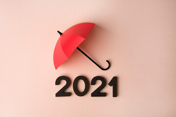 New Year 2021 with red umbrella on pink background