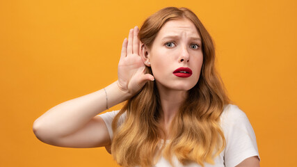 Young pretty woman with wavy redhead holding hand near ear