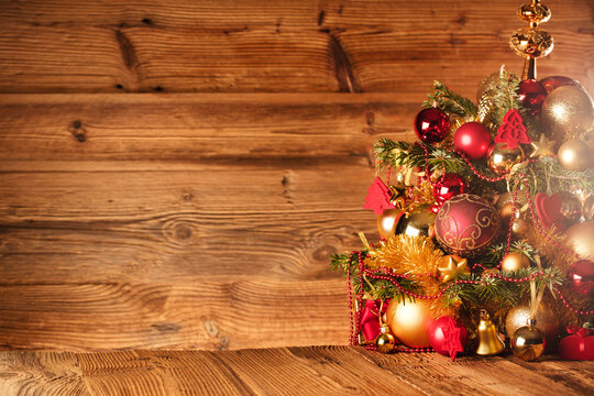 Christmas time concept. Christmas decoration in golden and brownish aesthetics. Christmas  presents in golden boxes.  