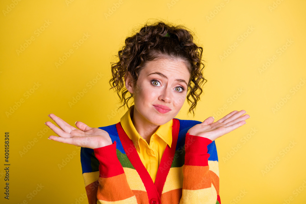 Sticker Photo of pretty lady raise arms shrug shoulders wear rainbow sweater pullover isolated yellow color background