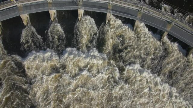 Water flowing over weir. view from above.