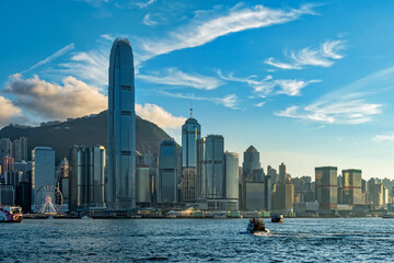 Views of Hong Kong skyline from Victoria Harbor at sunset