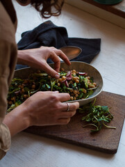 Rustic chickpea fresh green salad in bowl on table.