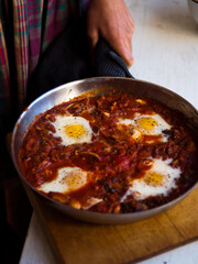 Home made shakshuka in rustic kitchen