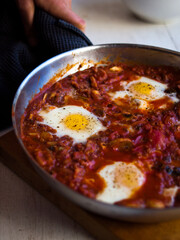 Home made shakshuka in rustic kitchen