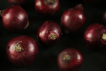 sweet red onions on background