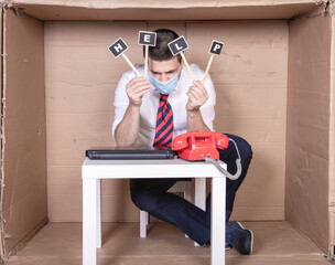 desperate businessman holds in his hands signs with the word help