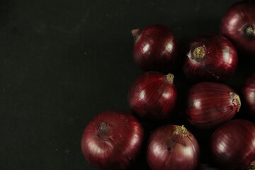 sweet red onions on background