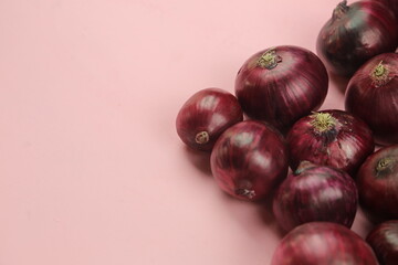 sweet red onions on background