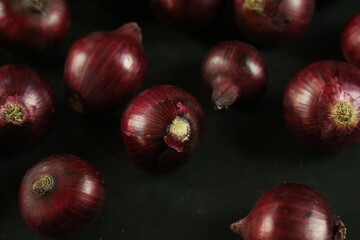 sweet red onions on background