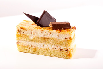 White chocolate cake slice  on white background
