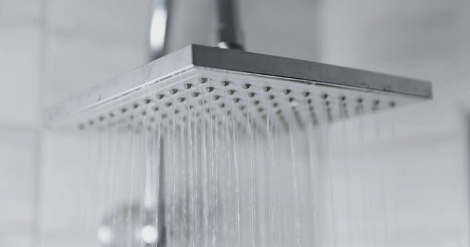Water flowing from shower head 120 fps slow motion closeup footage