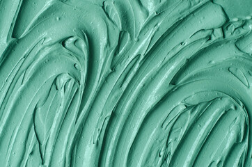Green cosmetic clay (kelp facial mask, face cream, spirulina body wrap) texture close up, selective...