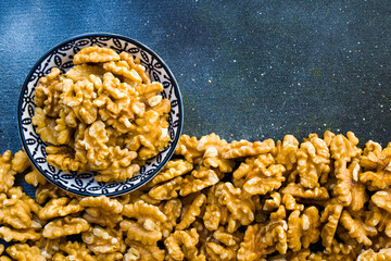 Walnuts on the blue background, walnut snack