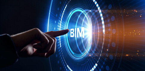 The concept of business, technology, the Internet and the network. A young entrepreneur working on a virtual screen of the future and sees the inscription: BIM