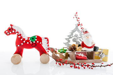 santa claus with gifts on wooden sledge