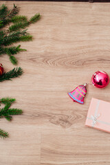 Christmas Tree Branches and on a Wooden Background with Copy Space