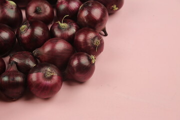 sweet red onions on background