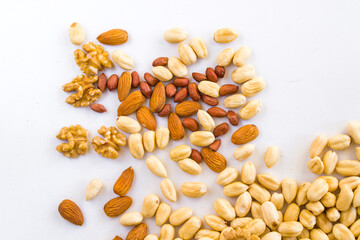 Almonds, peanut, walnut and hazelnuts in the bowl, beer and healthy snack