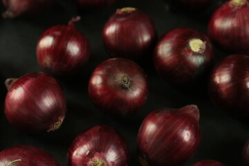 sweet red onions on background