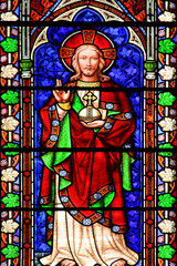 Obraz premium Jesus Christ shown in an image on a medieval stained glass window panel, stock photo 