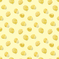 Seamless pattern made from Potato chips on yellow background flat lay. potato snack chips isolated Fast food banner.