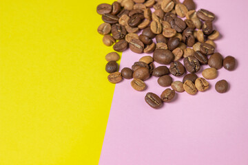 Coffee beans on a geometric background. Colored background. Background for design, lettering or logo. Different roasted coffee beans