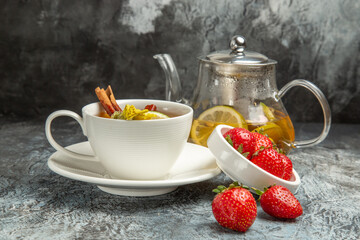 front view cup of tea with strawberries on dark background fruit tea berry