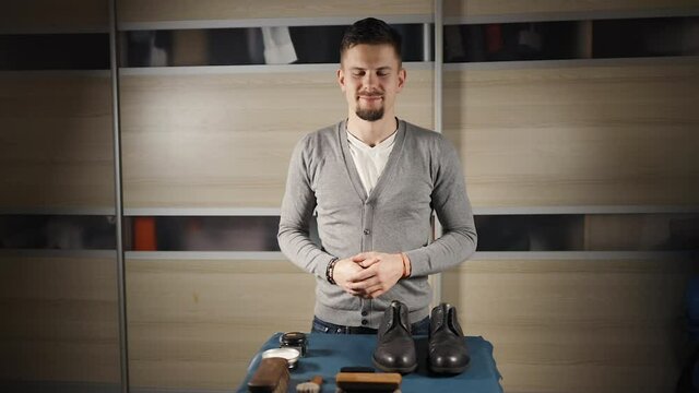 Male blogger filming tutorial about shoe care