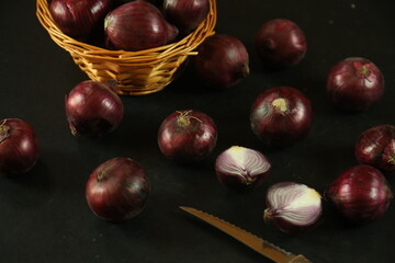 sweet red onions on background