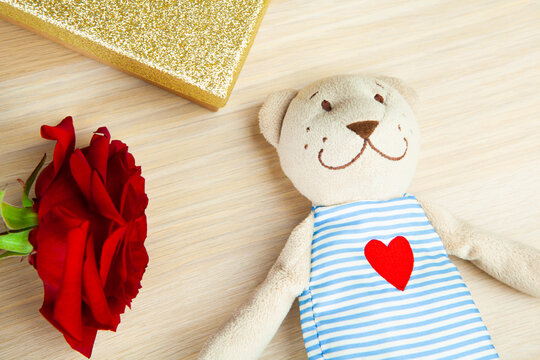 image of flower toy bear box wooden desk background 