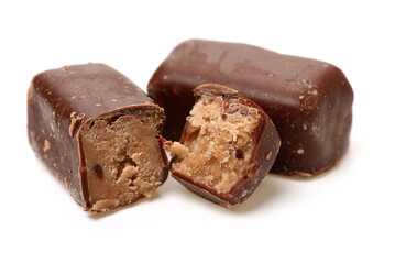 Chocolate peanut candy on white background