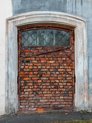 window or entrance bricked and closed grid