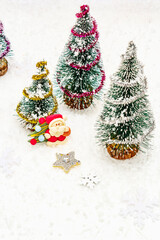 Small decorative Christmas trees with New Year's decor