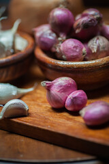 shallots and garlic in a wooden bowl