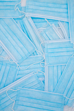 Vertical background with blue protection masks in times of covid 19