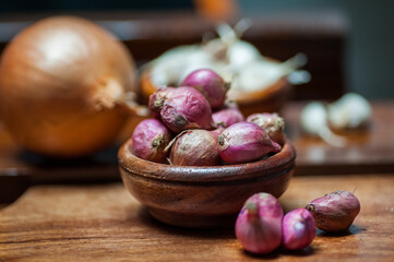 shallots and garlic in a wooden bowl
