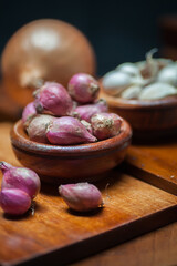 shallots and garlic in a wooden bowl
