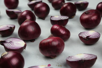 sweet red onions on background