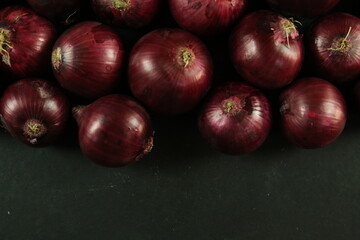 sweet red onions on background