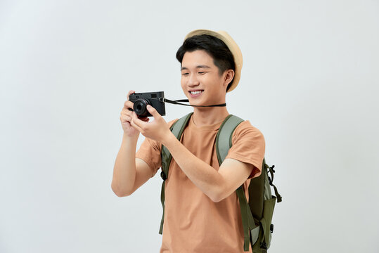 Full length portrait of happy tourist photographer man on white background. Travel blogger, tourist man.