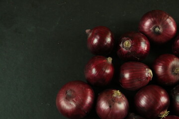 sweet red onions on background
